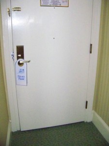 Two peepholes in the door - one lowered